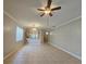 Open living room and kitchen with tile floors at 5119 Santa Ana Dr, Orlando, FL 32837