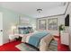 Bright bedroom with a comfortable bed and red carpet at 5217 N Apopka Vineland Rd, Orlando, FL 32818