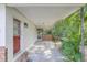 Covered carport with brick and white exterior walls at 5217 N Apopka Vineland Rd, Orlando, FL 32818