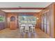 Cozy dining area with a white table and chairs, hardwood floors, and wood cabinets at 5217 N Apopka Vineland Rd, Orlando, FL 32818