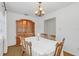 Bright dining room featuring a wood table and hutch at 5217 N Apopka Vineland Rd, Orlando, FL 32818