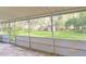 Screened porch overlooking a large backyard with shed at 5217 N Apopka Vineland Rd, Orlando, FL 32818