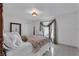 Cozy bedroom, floral bedding, and a four-poster bed at 539 Pinehurst Cv, Kissimmee, FL 34758