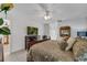 Bedroom with a king-size bed and flat screen TV at 539 Pinehurst Cv, Kissimmee, FL 34758