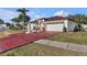 House exterior with a two-car garage and manicured lawn at 539 Pinehurst Cv, Kissimmee, FL 34758