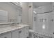 Modern bathroom with white vanity, marble countertop, and a glass shower at 567 Osceola Ave, Winter Park, FL 32789