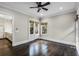 Spacious bedroom with hardwood floors, ceiling fan, and access to kitchen at 567 Osceola Ave, Winter Park, FL 32789