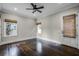 Bright bedroom with hardwood floors, ceiling fan, and French doors at 567 Osceola Ave, Winter Park, FL 32789