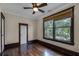 Well-lit bedroom with hardwood floors and dark wood window trim at 567 Osceola Ave, Winter Park, FL 32789