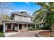 Charming two-story home with a large front porch and brick driveway at 567 Osceola Ave, Winter Park, FL 32789