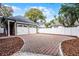 Two-car garage with paver driveway and landscaping at 567 Osceola Ave, Winter Park, FL 32789