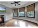 Living room with hardwood floors, fireplace, and large windows with scenic views at 567 Osceola Ave, Winter Park, FL 32789