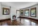 Living room with hardwood floors, fireplace, and bay windows at 567 Osceola Ave, Winter Park, FL 32789