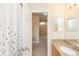 Bathroom with shower and access to another room at 587 Bluff Pass Dr, Eustis, FL 32726