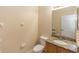 Small bathroom with granite countertop and toilet at 587 Bluff Pass Dr, Eustis, FL 32726