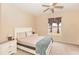 Spacious bedroom with carpeted floor and backyard view at 587 Bluff Pass Dr, Eustis, FL 32726