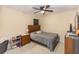 Bedroom with bed, nightstand, and ceiling fan at 587 Bluff Pass Dr, Eustis, FL 32726