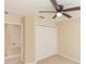 Bright bedroom with double door closet and ceiling fan at 587 Bluff Pass Dr, Eustis, FL 32726