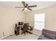 Home office or bedroom with window, desk, and seating at 587 Bluff Pass Dr, Eustis, FL 32726