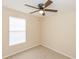 Bedroom with window, ceiling fan, and neutral walls at 587 Bluff Pass Dr, Eustis, FL 32726