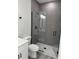 Modern bathroom with a large walk-in shower and gray tile at 6579 Sw 132Nd St, Ocala, FL 34473