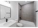 Bathroom featuring a shower over a tub, quartz countertop and modern fixtures at 6579 Sw 132Nd St, Ocala, FL 34473