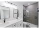 Modern bathroom with dual sinks, tiled shower with glass door, and updated fixtures at 6579 Sw 132Nd St, Ocala, FL 34473