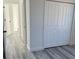 Bright bedroom with double doors leading to a spacious closet at 6579 Sw 132Nd St, Ocala, FL 34473