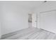 Bright bedroom featuring wood-look flooring and a closet at 6579 Sw 132Nd St, Ocala, FL 34473