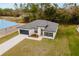 Aerial view of the home showing its large driveway and welcoming front entrance at 6579 Sw 132Nd St, Ocala, FL 34473