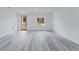 Bright living room featuring light gray flooring, a modern door, a window with natural light at 6579 Sw 132Nd St, Ocala, FL 34473