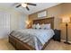 Primary bedroom with king bed and rustic wood headboard at 7773 Basnett Cir, Kissimmee, FL 34747