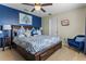 Spacious bedroom with king-size bed and sitting area at 7773 Basnett Cir, Kissimmee, FL 34747