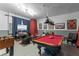 Game room features a pool table and foosball table at 7773 Basnett Cir, Kissimmee, FL 34747