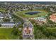 Aerial view of community gated entrance and surrounding landscape at 7773 Basnett Cir, Kissimmee, FL 34747