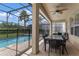 Outdoor dining area with pool view at 7773 Basnett Cir, Kissimmee, FL 34747