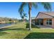 Peaceful backyard oasis with lake view and screened patio at 7927 Oakstone Ct, Orlando, FL 32822