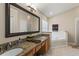 Bathroom with granite countertops and a large soaking tub at 7927 Oakstone Ct, Orlando, FL 32822