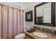 Guest bathroom with granite vanity and shower at 7927 Oakstone Ct, Orlando, FL 32822