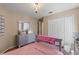 Pastel bedroom with double door closet at 7927 Oakstone Ct, Orlando, FL 32822