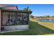 View of the home's exterior, highlighting the screened patio at 7927 Oakstone Ct, Orlando, FL 32822