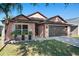 Attractive one-story home with a two-car garage and well-manicured lawn at 7927 Oakstone Ct, Orlando, FL 32822