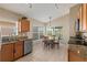 Well-lit kitchen with a breakfast nook overlooking a pond at 7927 Oakstone Ct, Orlando, FL 32822