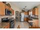 Modern kitchen with stainless steel appliances and granite countertops at 7927 Oakstone Ct, Orlando, FL 32822