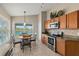 Bright kitchen with stainless steel appliances and breakfast nook at 7927 Oakstone Ct, Orlando, FL 32822