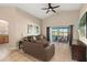 Relaxing living room featuring a sliding glass door leading to a patio or backyard at 7927 Oakstone Ct, Orlando, FL 32822