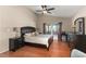 Spacious main bedroom with wood floors and large windows at 7927 Oakstone Ct, Orlando, FL 32822