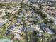 Aerial view of a community of townhouses, tennis court, and surrounding neighborhood at 8133 Citrus Chase Dr, Orlando, FL 32836