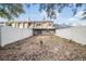 Private backyard with white fence and large tree at 8133 Citrus Chase Dr, Orlando, FL 32836