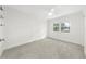 Well-lit bedroom featuring gray carpet and a large window at 8133 Citrus Chase Dr, Orlando, FL 32836